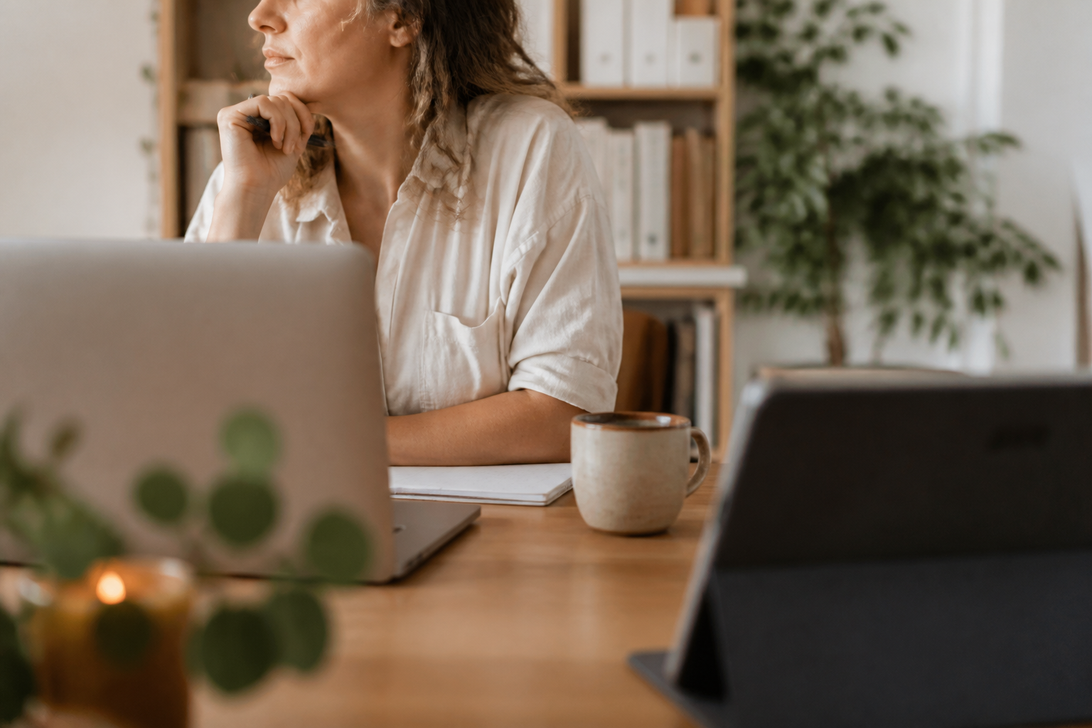 Knowledge worker pausing between focus and leisure, suggesting the tension of permission and guilt around media at work